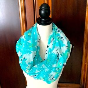 Uniquely woven light turquoise, white, and navy scarf